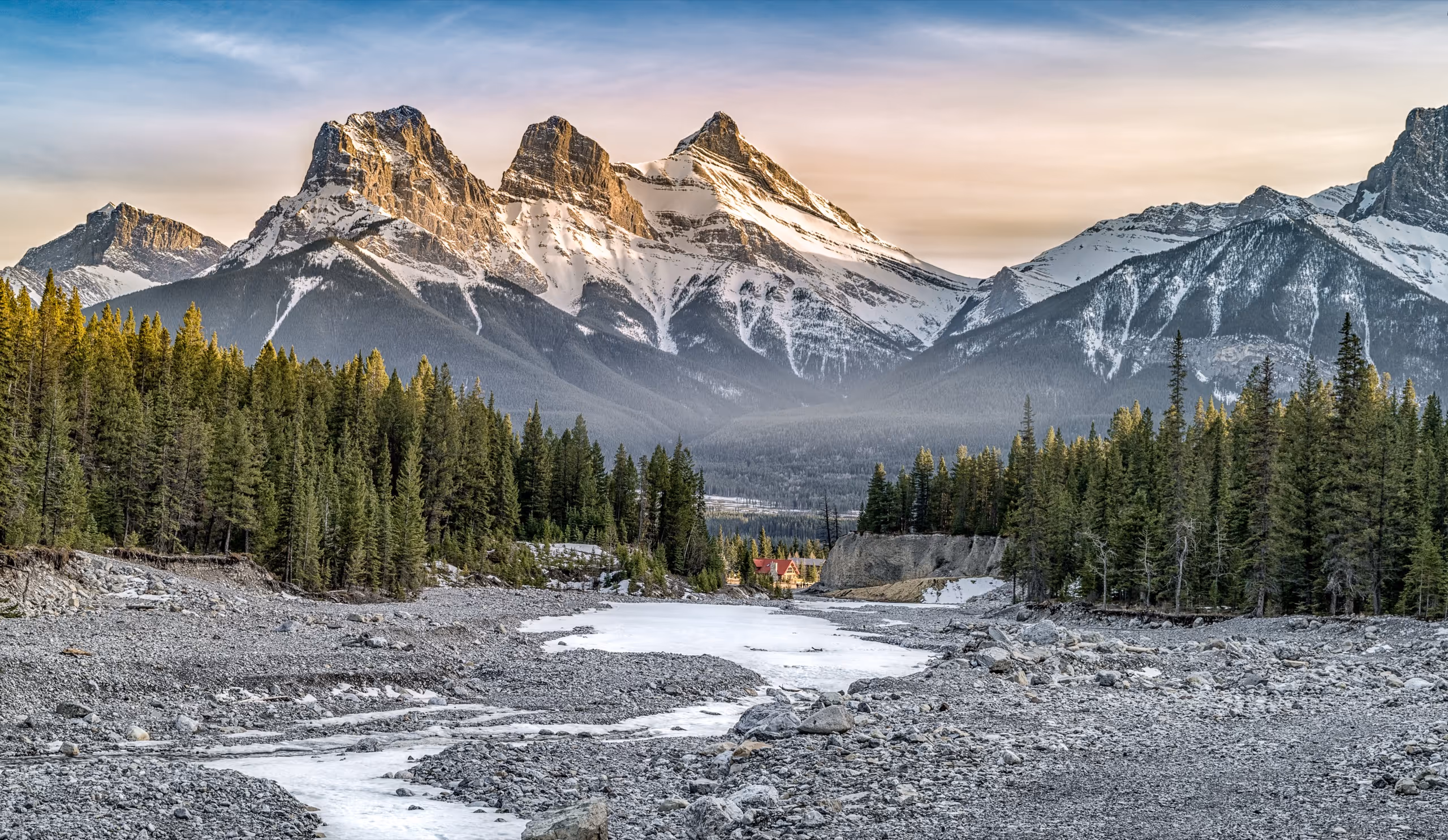 Snow-dusted peaks above a forested valley in Amelia County, Idaho.